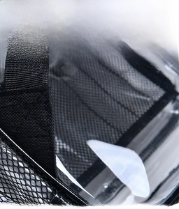 Detail of 30-mil thickened transparent PVC material and black nylon woven edge for backpacks