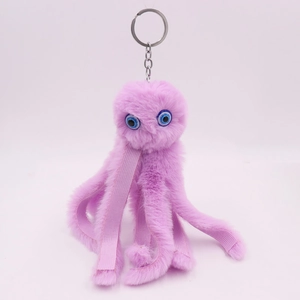 Detailed view of purple plush octopus keychain with soft tentacles and metal ring