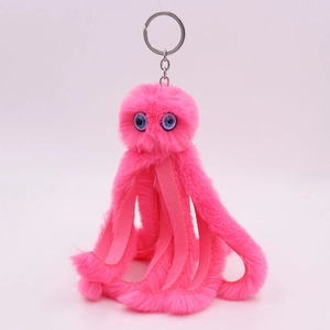 Close-up of pink plush octopus keychain with blue eyes and durable metal keyring