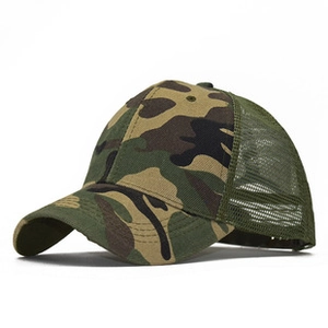 Side view of camo trucker hat featuring jungle print canvas and green mesh back panel