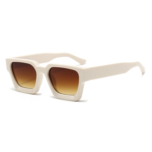 Detail of square oversized sunglasses with cream frame and brown gradient lenses