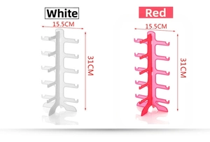 Detail of red and white 5-tier plastic sunglass display racks with symmetrical hooks