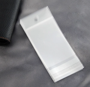 Detail of thick transparent plastic self-sealing jewelry bags with hanging holes