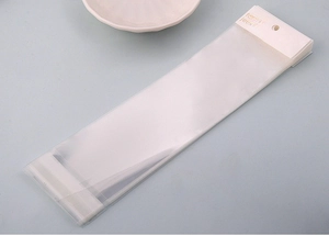 Detail of transparent jewelry packaging bags with fashion jewellery header cards