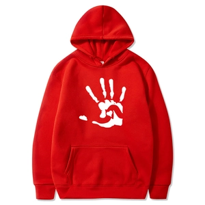 Detailed view of the red fleece hoodie featuring a white heart handprint graphic