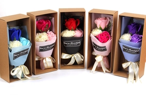 Detail of five carnation and rose soap flower gift boxes with elegant ribbon bows