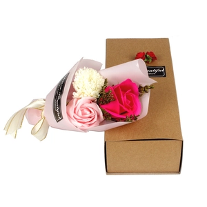 Detail view of pink soap flower bouquet with roses and carnation in a craft gift box