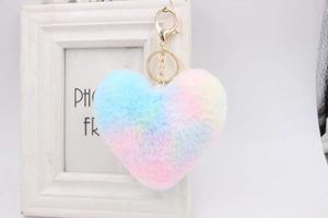 Close-up of rainbow heart faux fur keychain with gold lobster clasp and metal chain