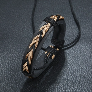 Retro braided black leather bracelet with gold wire pattern and adjustable knot closure