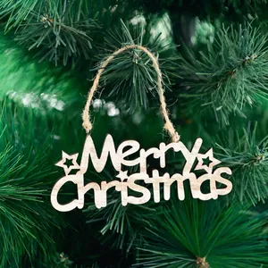 Wooden Merry Christmas ornament with hollow lettering hanging on a festive tree branch