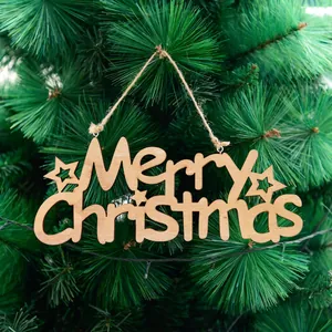 Hollow wooden Merry Christmas hanging ornament with stars on a green pine tree
