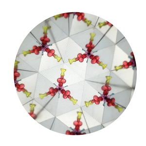 Internal view of a kaleidoscope showing symmetrical hexagonal red and yellow patterns
