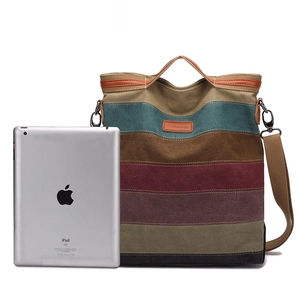 Striped canvas tote bag with adjustable shoulder strap and leather brand label