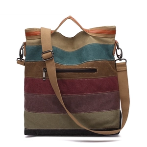Striped canvas tote bag with adjustable shoulder strap and leather handles