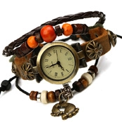 Detailed view of vintage layered leather watch bracelet with bronze charms and orange beads