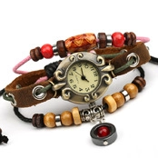 Macro shot of retro leather bracelet watch with bronze dial and assorted wooden beads