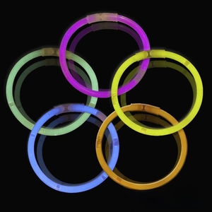 Vibrant neon glow sticks bracelets in five colors interlocking on black background