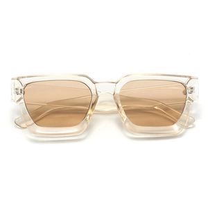 Detailed view of square champagne transparent frames and light brown UV lenses