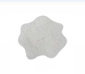 Detailed macro view of star-shaped light grey canvas patch with woven texture