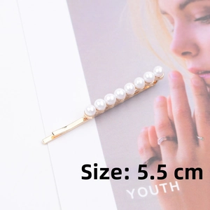 Detailed view of a 5.5cm gold-tone hair clip featuring eight aligned white faux pearls