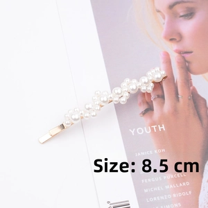 Close-up of an 8.5cm elegant pearl hair clip with a golden alloy base and white pearls