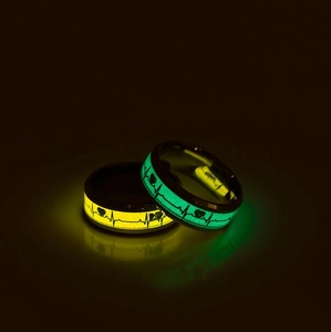 Luminous couple rings with orange and blue heart ECG patterns on black stainless steel band