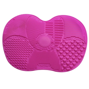 Large rose pink silicone makeup brush cleaning mat with suction cups and multi-texture zones