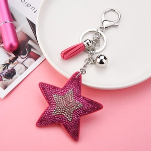 Porte-clés étoile avec strass, paillettes rose fuchsia et pompon décoratif chic