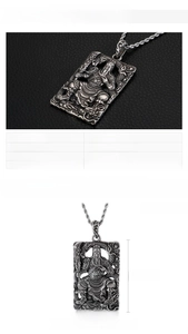Macro view of stainless steel Guan Yu pendant detailing embossed texture and size 50x33mm