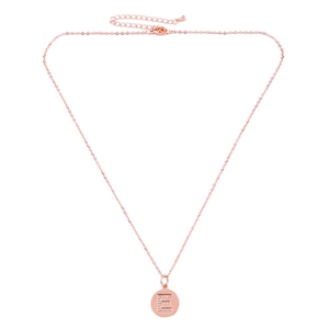 Close-up of rose gold letter E pendant with pavé crystals on a delicate chain necklace
