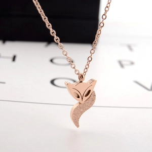 Rose gold fox pendant necklace with polished finish and glitter texture on minimalist O-chain