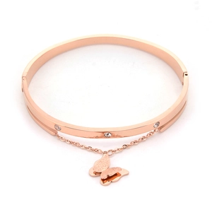 Polished rose gold titanium bangle with zirconia accents and hanging butterfly pendant