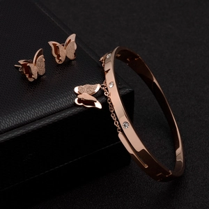 Rose gold butterfly jewelry set including polished zircon bracelet and matching stud earrings