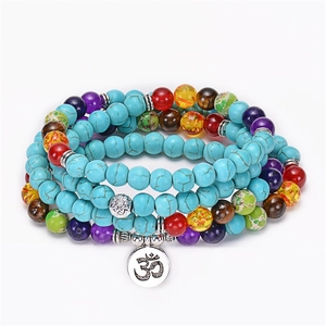 Detailed close-up of 108 turquoise prayer beads with colorful chakra stones and Om charm