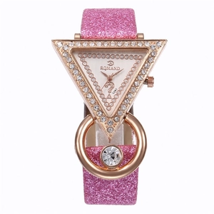Detail of rose gold triangle watch face with rhinestones and pink glitter strap