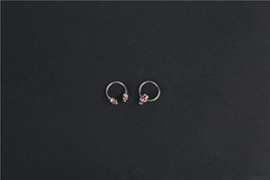 Gothic punk horseshoe and captive bead rings with silver skull designs and red eye stones