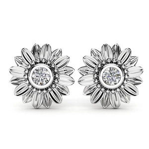 Macro shot of silver sunflower earrings featuring round center stones and textured petals