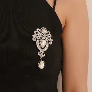 Elegant crown crystal brooch with teardrop pendant in silver finish on black fabric
