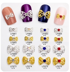 Detailed chart of hollow alloy bow nail charms with rhinestones in gold and silver