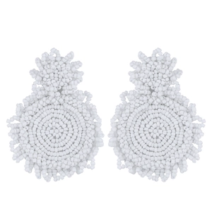 Detailed macro view of handmade white seed bead mandala earrings with double circle design