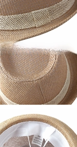 Detail of 100% paper straw sun hat showing interior sweatband and care label
