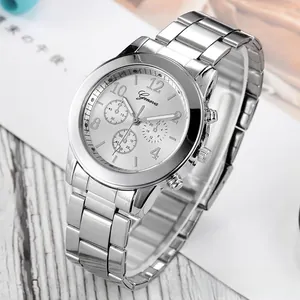 Detail view of silver Geneva quartz watch showing triple link steel band and dial