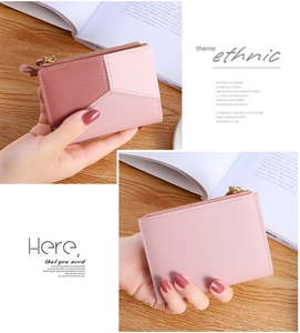 Detailed view of pink patchwork faux leather short wallet with secure zip closure