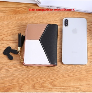 Compact tri-color women's wallet with tassel zipper compared to a smartphone for size
