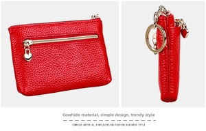Detail of red cowhide leather coin purse with heart-shaped zipper and key ring loop