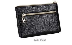 Back view of black pebble leather coin purse with gold zipper and heart pendant