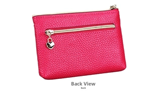 Detail showing the back of the genuine leather coin purse with heart zipper and pocket