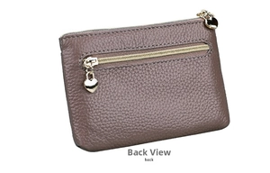 Detail of genuine leather coin purse showing back zip pocket with gold heart charm