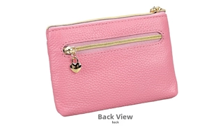 Back view of pink pebbled leather coin purse with double gold heart zippers