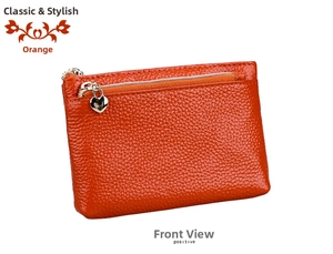 Detail of orange-brown pebble leather coin purse with heart-shaped zipper and card slot